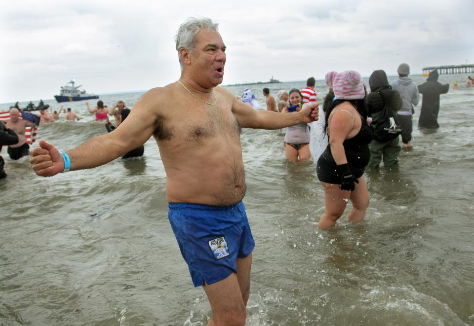 NEW YORK, NY - JANUARY 1: A man reacts as he feels the elements during the Coney Island Polar Bear Club's New Year's Day swim on January 1, 2013 in the Coney Island neighborhood of the Brooklyn borough of New York City. The annual event attracts hundreds who brave the icy Atlantic waters and temperatures in the upper 30's as a way to celebrate the first day of the new year. (Photo by Monika Graff/Getty Images)