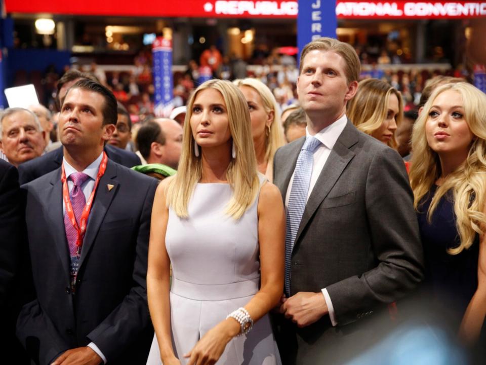 Donald Trump Jr. (L), along with Ivanka Trump (2nd-L), Eric Trump (2nd-R) and Tiffany Trump (R), as votes add up during the roll call in support of Republican presidential candidate Donald Trump on the second day of the Republican National Convention on July 19, 2016 at the Quicken Loans Arena in Cleveland, Ohio. 