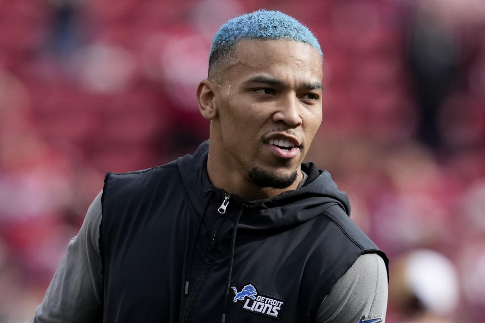 Detroit Lions wide receiver Amon-Ra St. Brown watches during warm ups before the NFC Championship NFL football game between the San Francisco 49ers and the Detroit Lions in Santa Clara, Calif., Sunday, Jan. 28, 2024. (AP Photo/Godofredo A. Vasquez)