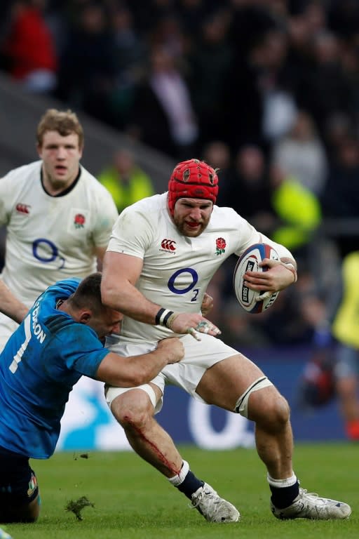 England's flanker James Haskell is tackled by Italy's Simone Favaro during a Six Nations match at Twickenham in south-west London, in February 2017