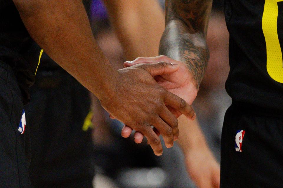 Utah Jazz guard Ochai Agbaji (30) and Utah Jazz guard Jordan Clarkson (00) high five during the NBA basketball game between the Utah Jazz and the Dallas Mavericks at the Delta Center in Salt Lake City on Monday, Jan. 1, 2024. | Megan Nielsen, Deseret News