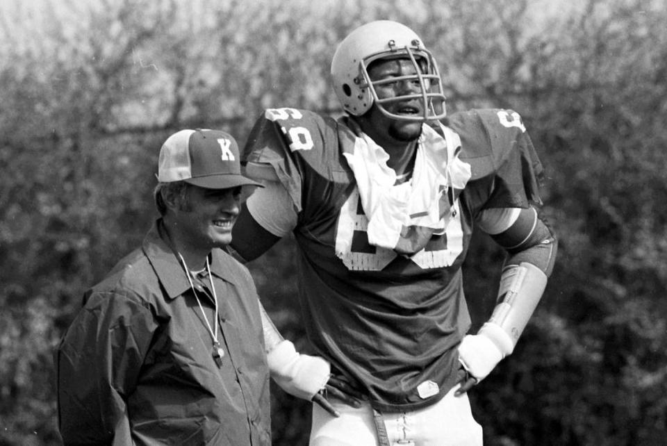 Kentucky football coach Fran Curci and star offensive tackle Warren Bryant took in a spring practice session together in March 1976. Bryant was a cornerstone of Kentucky’s 1976 SEC co-championship team.