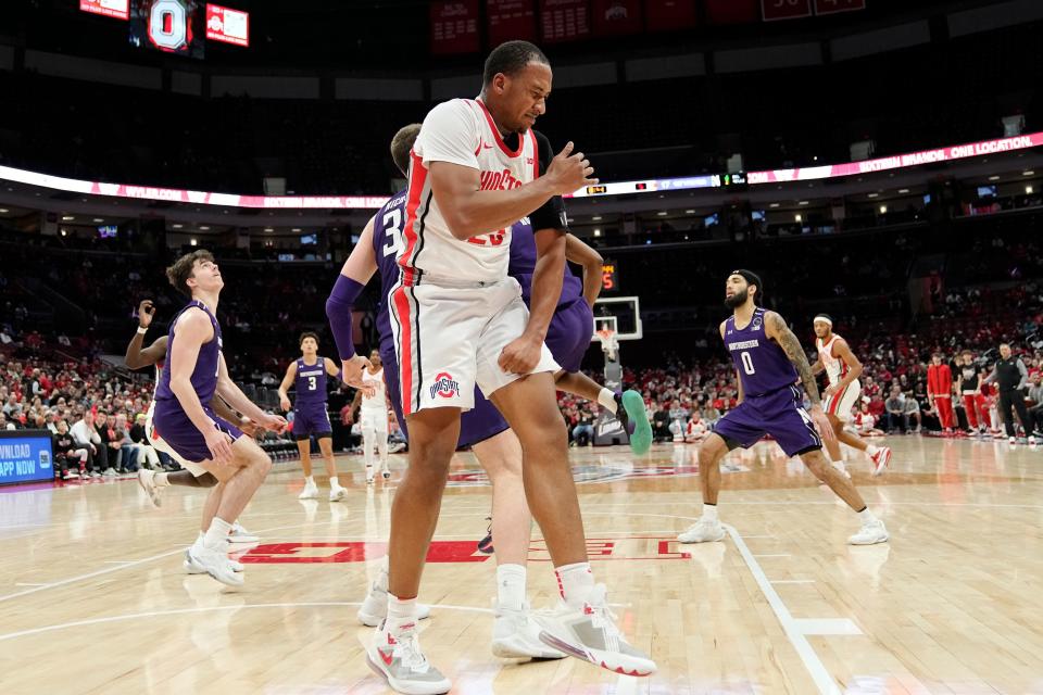 Feb 9, 2023; Columbus, OH, USA;  Ohio State Buckeyes forward Zed Key (23) grabs his shoulder in pain during the first half of the NCAA men’s basketball game against the Northwestern Wildcats at Value City Arena. Mandatory Credit: Adam Cairns-The Columbus Dispatch