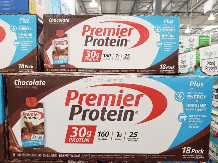 large brown, white, and blue boxes of premier protein shakes at Costco