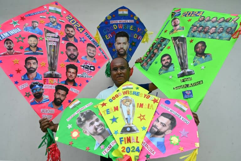 A man displays his kites decorated with pictures of Indian and South African cricket players in Amritsar, northern India (Narinder NANU)