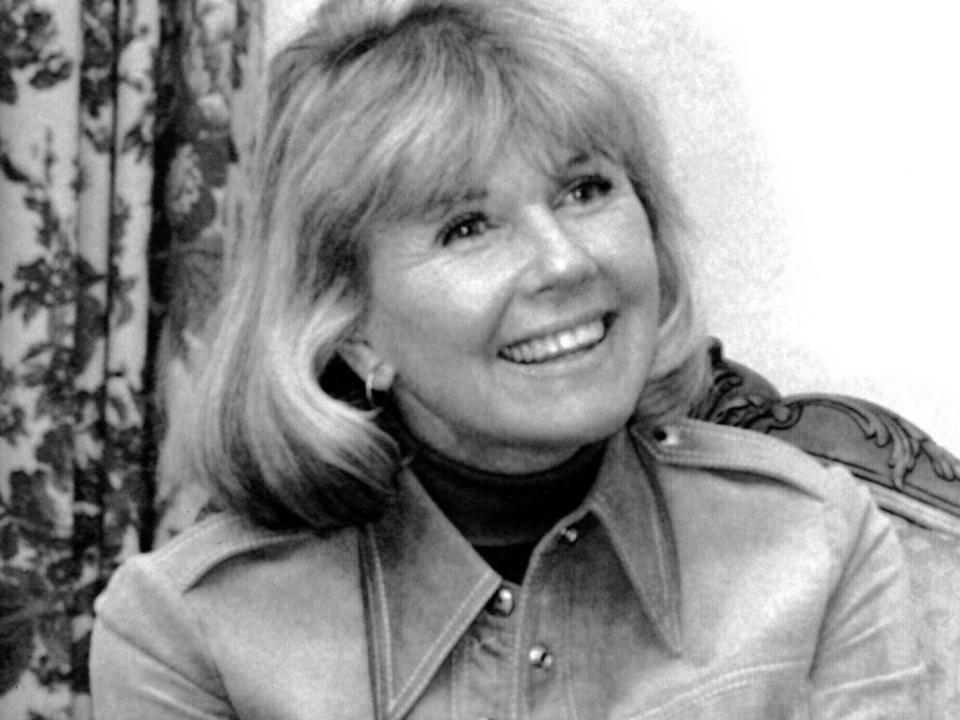 FILE - In this Jan. 6, 1976 file photo, actress and singer Doris Day answers questions in New York, during an interview on the book "Doris Day: Her Own Story," written by A.E. Hotchner. Day, whose wholesome screen presence stood for a time of innocence in '60s films, has died, her foundation says. She was 97. The Doris Day Animal Foundation confirmed Day died early Monday, May 13, 2019, at her Carmel Valley, California, home.(AP Photo, File)