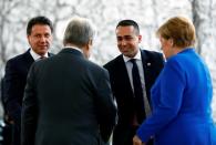 German Chancellor Angela Merkel and United Nations Secretary-General Antonio Guterres welcome Italian Prime Minister Giuseppe Conte and Italian Foreign Minister Luigi Di Maio at the Libya summit in Berlin