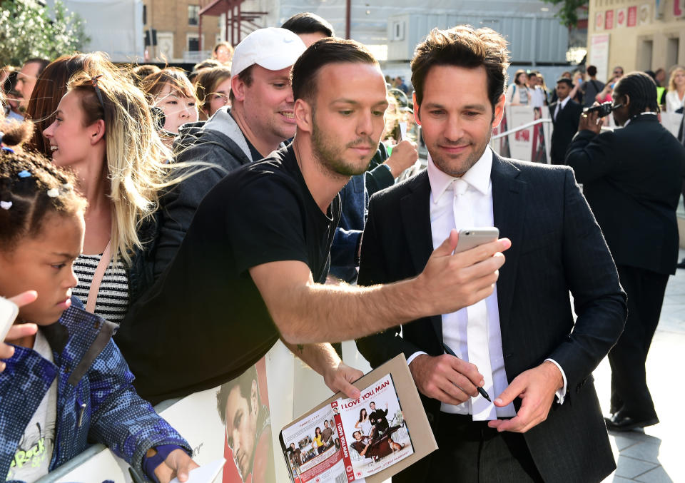 Paul Rudd poses for a selfie with a fan whilst arriving for the Ant-Man premiere, at the Odeon Leicester Square, London. PRESS ASSOCIATION Photo. Picture date: Wednesday July 8, 2015. Photo credit should read: Ian West/PA Wire