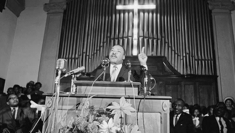 Dr. Martin Luther King Jr., center, speaks to a wildly cheering crowd of African American supporters on Jan. 2, 1965, in Selma, Ala. King was calling for a new African American voter registration drive throughout Alabama and promising to “march on the ballot boxes” unless African Americans were given the right to vote.