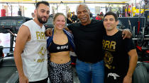 <p>(L-R) Trainer Edmond Tarverdyan, Ronda Rousey, former boxer Mike Tyson and Justin Flores at the Glendale Fight Club, California.</p>