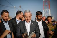 Israeli Prime Minister Benjamin Netanyahu attends a briefing near the Salem military post
