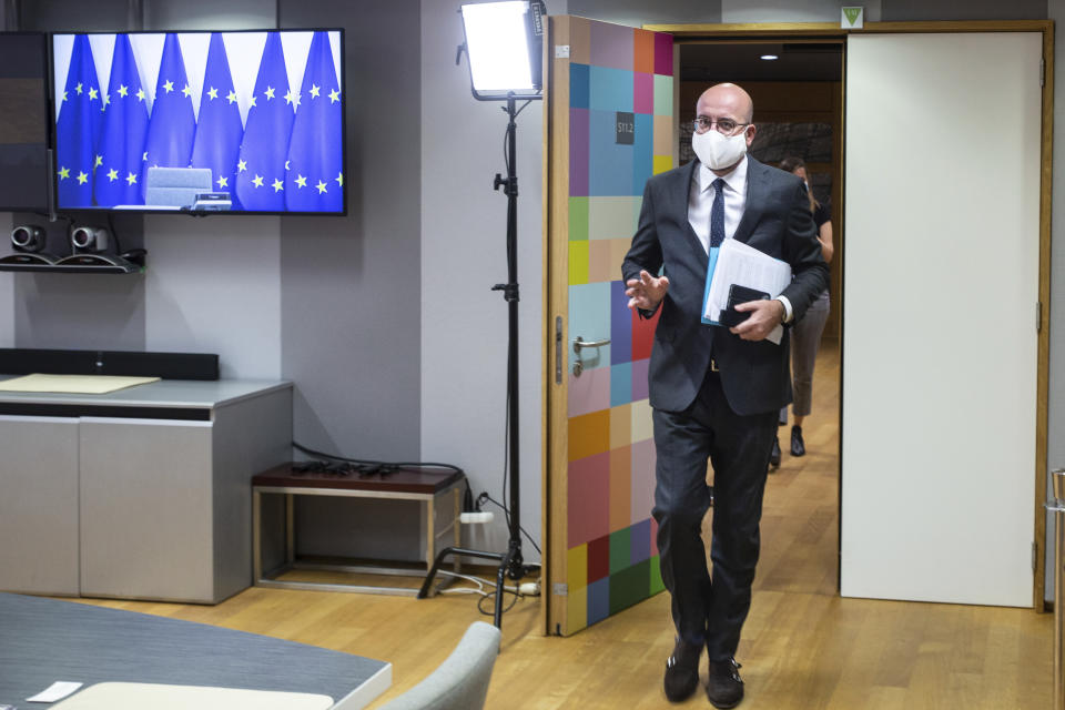 European Council President Charles Michel, wearing a protective face mask, arrives ahead of a video conference with German Chancellor Angela Merkel and Turkish President Recep Tayyip Erdogan at the European Council building in Brussels, Tuesday, Sept. 22, 2020. (Aris Oikonomou, Pool via AP)