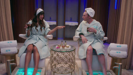 Tahani with a man in a spa