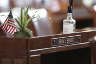 FILE - A desk in the Senate chambers belonging to Independent Sen. Brian Boquist is seen prior to a Senate session at the Oregon State Capitol in Salem, Ore., May 5, 2023. Republicans and an independent senator in the Oregon Senate stretched a walkout Monday to 10 days, triggering a new constitutional provision that prohibits lawmakers with 10 or more unexcused absences from being reelected. The walkout that began May 3 has stalled action on hundreds of bills, including on gun control, gender-affirming care and abortion rights, as a deadline threatened to disqualify them from being reelected. (AP Photo/Amanda Loman, File)