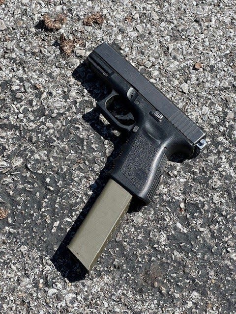 This Glock pistol with an extended magazine was found near a suspect fatally shot by Indianapolis Metropolitan Police earlier this year, police said. The switch, which can turn a pistol and some AR weapons into machine guns, is the little nub at the back of the gun.