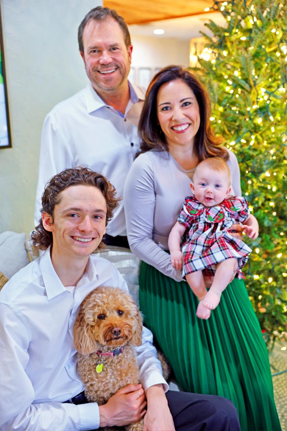 The Lambert family: Monte with Christina and baby Brianna Rene and Monte's son and Christina's stepson Noah with the family dogs, Cali and Ziggy.