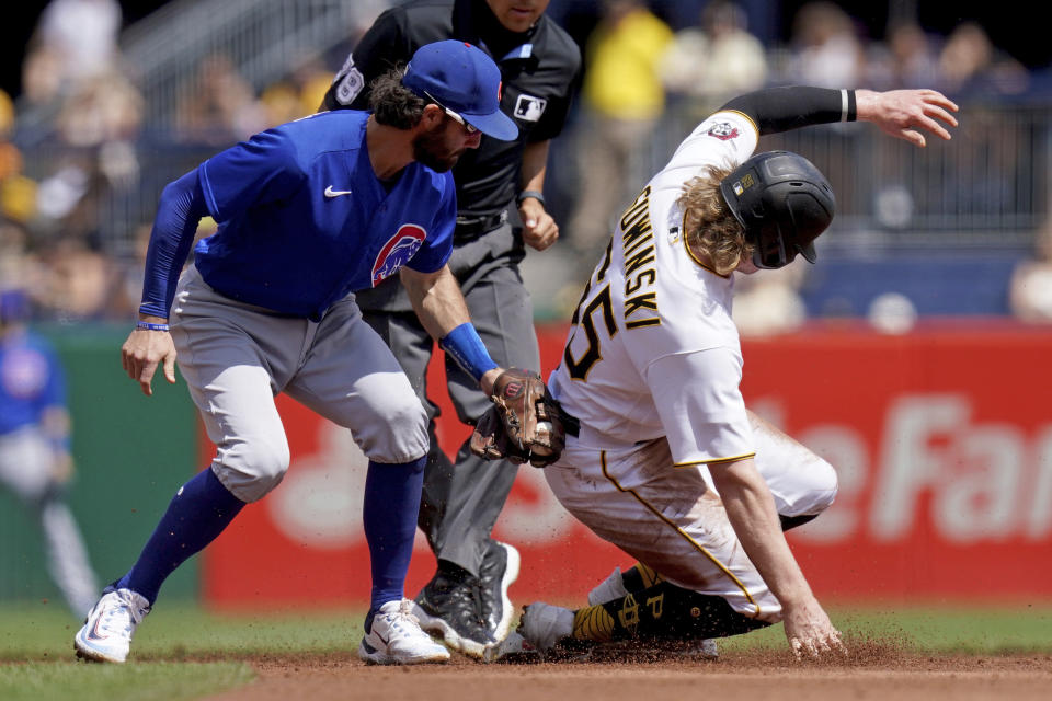 Pittsburgh Pirates' Jack Suwinski gets safely to second base on a steal against Chicago Cubs second baseman Dansby Swanson in the second inning of a baseball game in Pittsburgh, Sunday, Aug. 27, 2023. (AP Photo/Matt Freed)