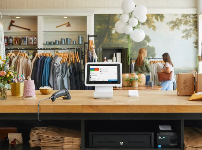 The Square point-of-sale system on the counter in a retail apparel store.