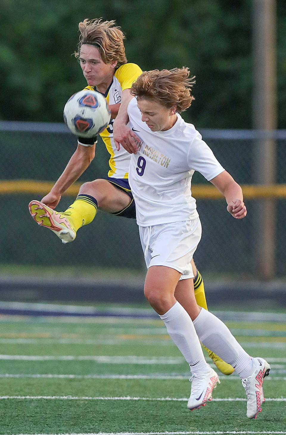 Copley's Calvin Cunat, left, and North Royalton's Nick Djukic collide going after a loose ball on Thursday, Aug. 25, 2022 in Copley.