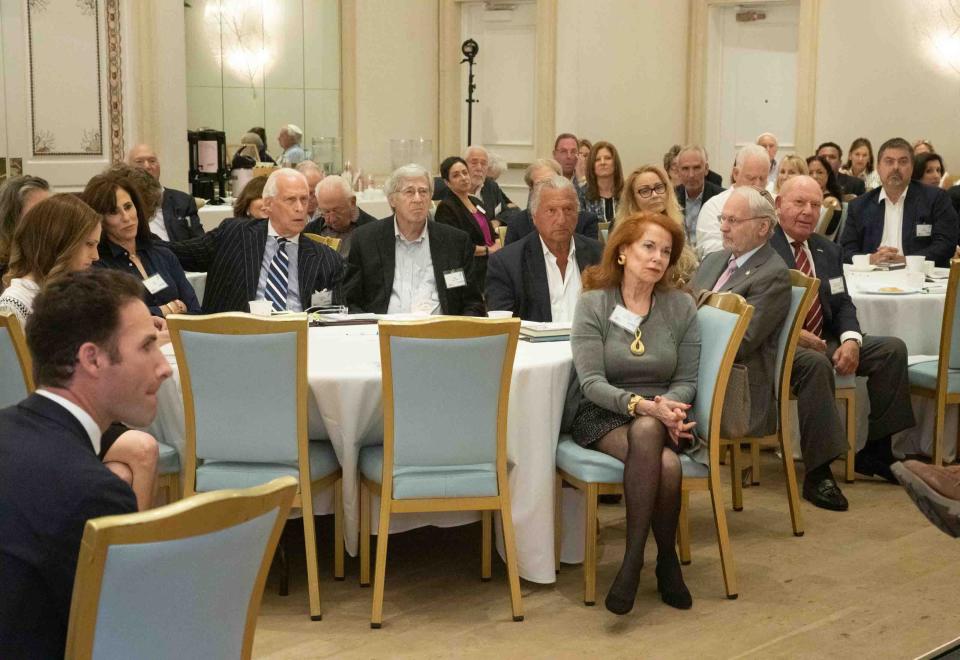 People listen to remarks from panelists during the second annual Palm Beach Summit on Countering Antisemitism.