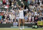 Agnieszka Radwanska of Poland celebrates after winning her match against Madison Keys of the U.S.A. at the Wimbledon Tennis Championships in London, July 7, 2015. REUTERS/Henry Browne