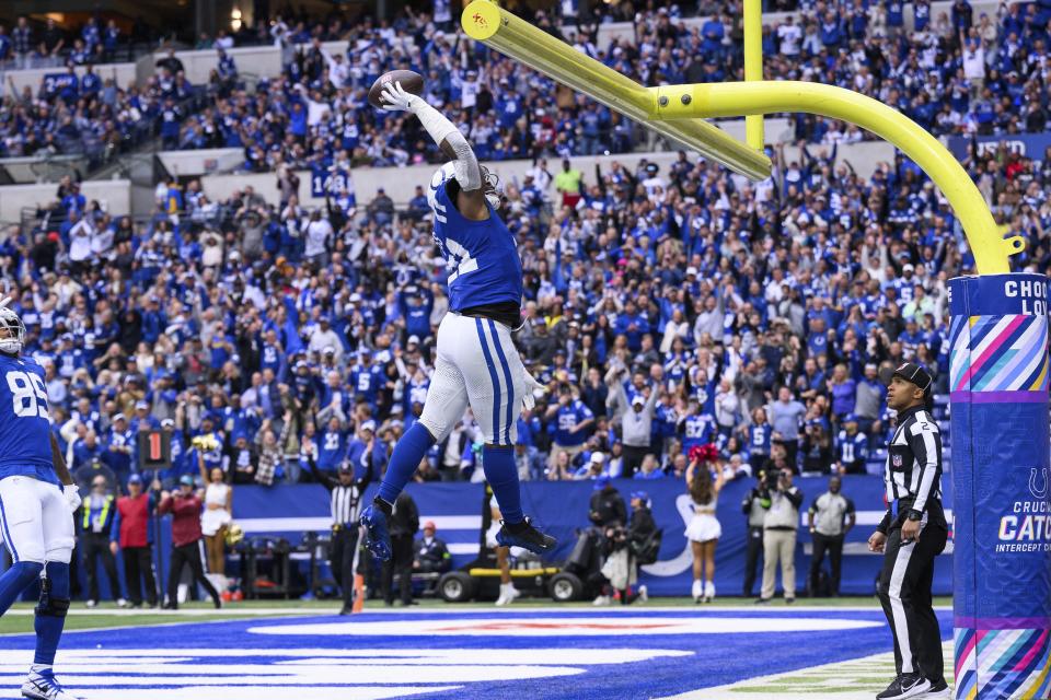 Indianapolis Colts running back Zack Moss (21) celebrates after a touchdown during an NFL football game against the Tennessee Titans, Sunday, Oct. 8, 2023, in Indianapolis. | Zach Bolinger, Associated Press