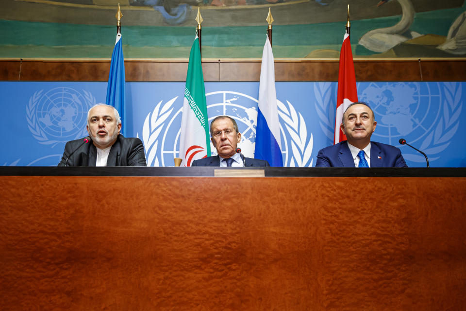 From left to right: Iranian Foreign Minister Mohammad Javad Zarif, Russian Foreign Minister Sergei Lavrov and Turkish Foreign Minister Mevlut Cavusoglu attend a press conference a day prior to the Syrian Constitutional Committee meeting in Geneva, at the European headquarters of the United Nations in Geneva, Switzerland, Tuesday, Oct. 29, 2019. Representatives from the Syrian government, opposition and civil society are to begin meeting in Geneva on Wednesday. (Valentin Flauraud, Keystone via AP)