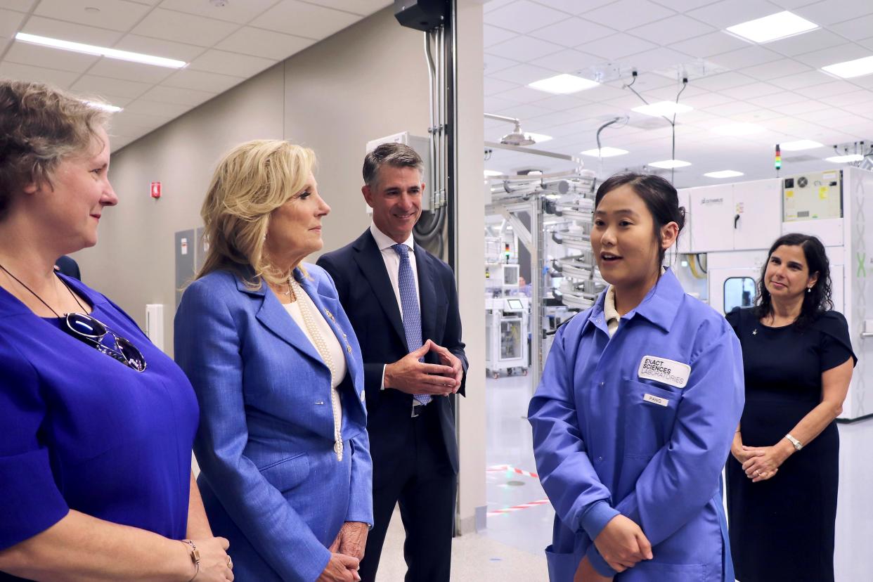 From left; Madison, Wis. Mayor Satya Rhodes-Conway, First lady Jill Biden, Exact Sciences Chairman and CEO Kevin Conroy, Exact Sciences Specimen Processing Lead Pang Kue-Polyakov and Exact Sciences Chief Laboratory Officer Ana Hooker converse at the cancer diagnostics company in Madison, Wis., Thursday, Aug. 31, 2023.