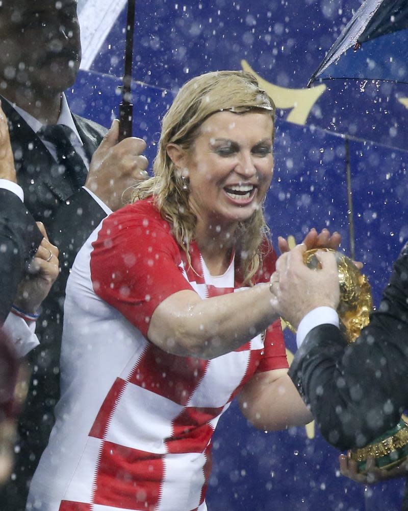 President of Croatia Kolinda Grabar-Kitarovic did not let rain stop play as she handed out the winners’ medals.
