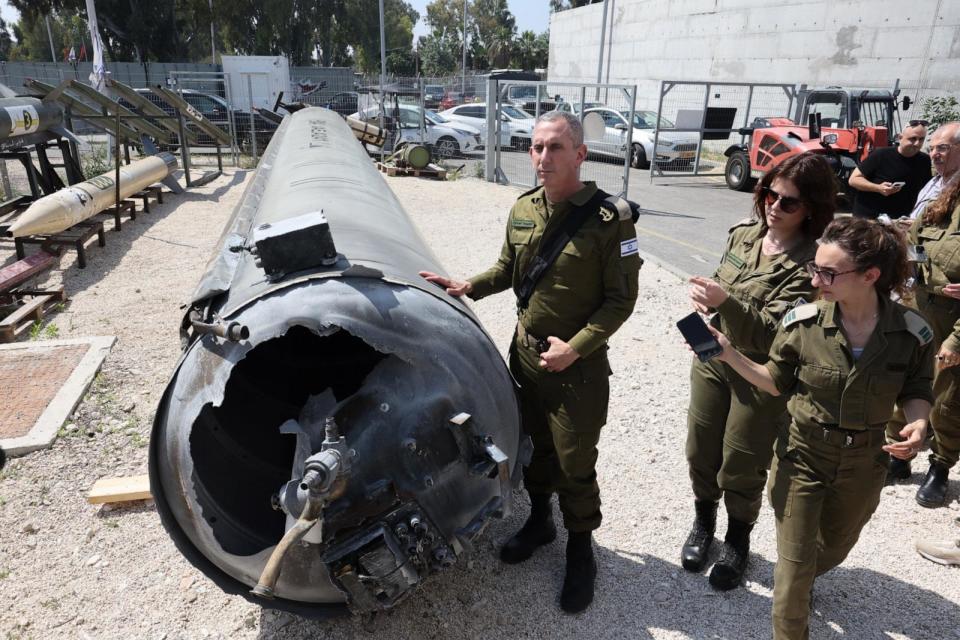 PHOTO: Members of the Israeli military show an Iranian ballistic missile which fell in Israel on the weekend, during a media tour at the Julis military base near the southern Israeli city of Kiryat Malachi on April 16, 2024.  (Gil Cohen-magen/AFP via Getty Images)