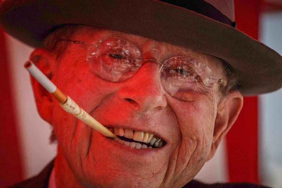 Delmas P. Wood, Jr., impersonating former President Franklin D. Roosevelt, left, of Boynton Beach, poses for photos at the Pearl Harbor remembrance and monument dedication at Veterans Memorial Park in Boynton Beach, Fla., on Tuesday, December 7, 2021. This year marks the 80th anniversary of the Japanese attack.