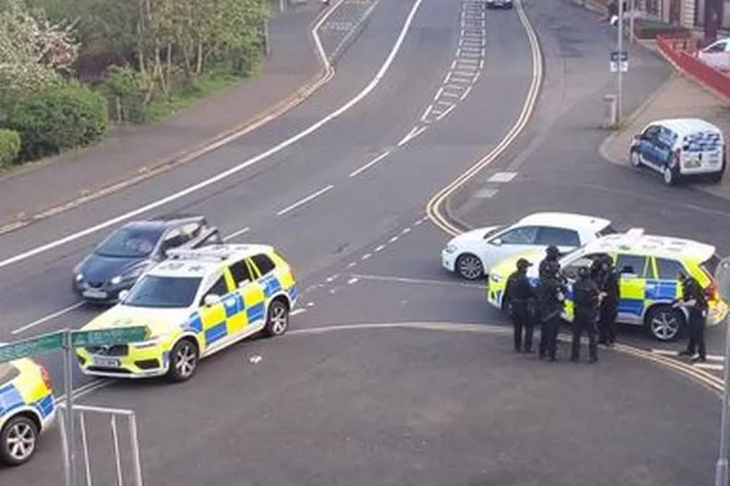 Officers gather on Atlas Road