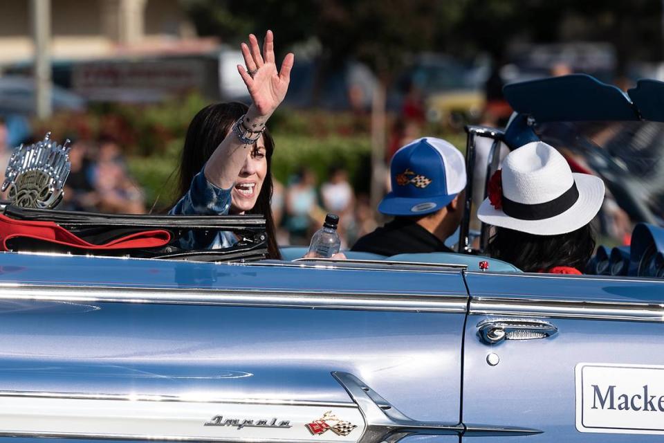 “American Graffiti” actress MacKenzie Phillips waves to the crowd on McHenry Avenue during the Graffiti Parade in Modesto, Calif., Friday, June 9, 2023.