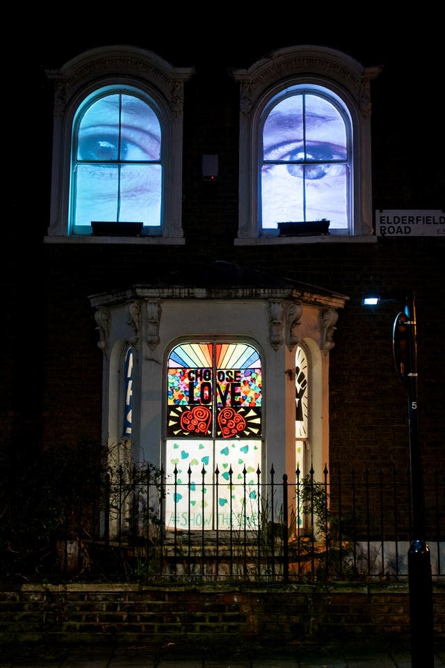 A window decorated with eyes