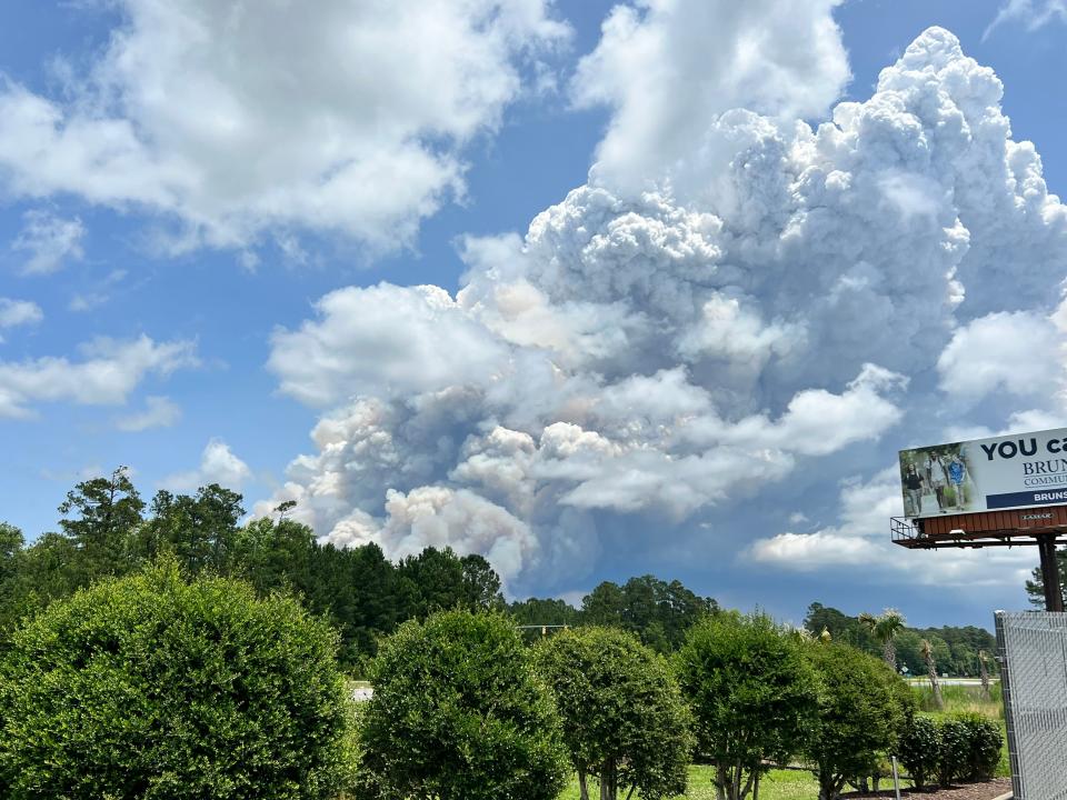 Large plumes of smoke radiate from a wildfire in the Green Swamp Game Land. Photo taken Friday at the BP Station on Old Ocean Highway in Bolivia.