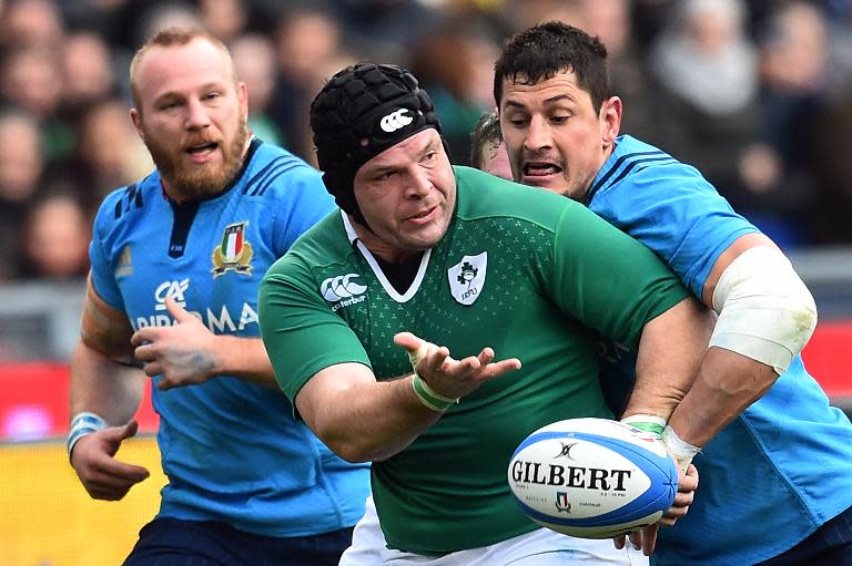 Ireland's prop Mike Ross is tackled by Italy's flanker Alessandro Zanni (R) during their Six Nations match at the Olympic Stadium in Rome on February 7, 2015