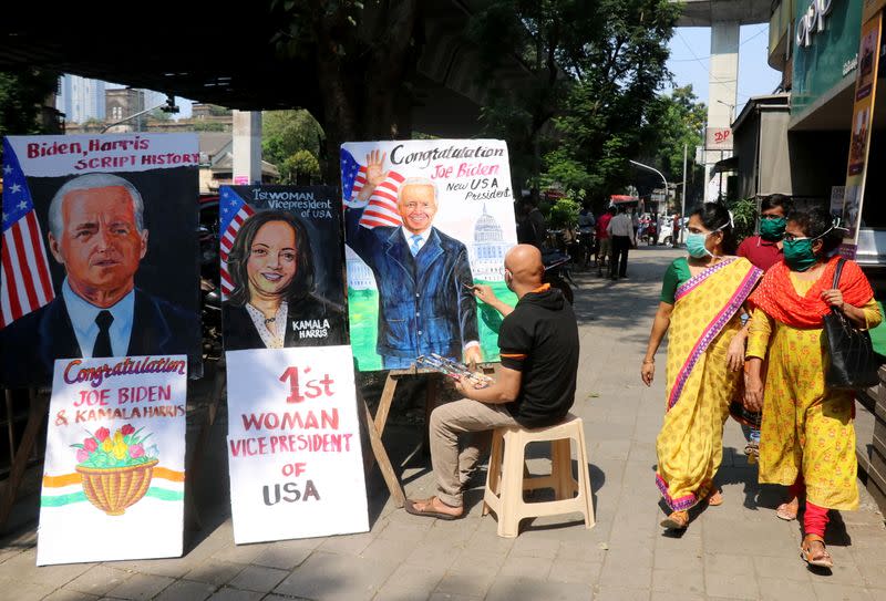 Artist applies finishing touches to painting of U.S. President-elect Joe Biden, in Mumbai