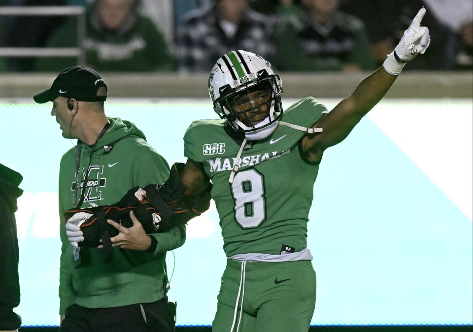 HUNTINGTON, WEST VIRGINIA – OCTOBER 29: Isaiah Norman #8 of the Marshall Thundering Herd is helped off the field after injuring his arm in the third quarter against the Coastal Carolina Chanticleers at Joan C. Edwards Stadium on October 29, 2022 in Huntington, West Virginia. (Photo by Greg Fiume/Getty Images)