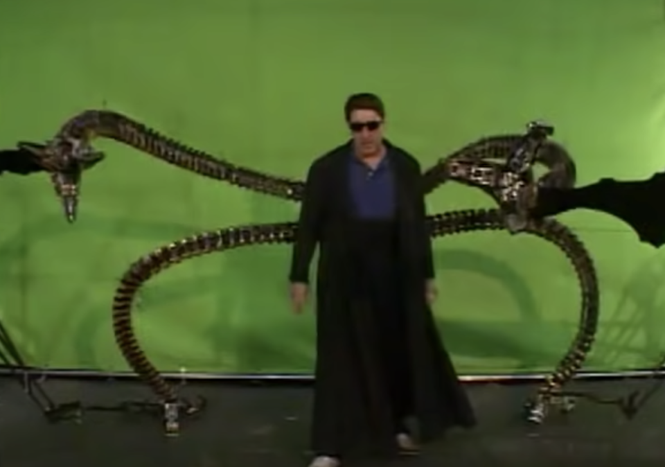 green screen behind the actor using the steel tentacles