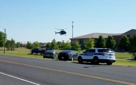 A helicopter lands near Noblesville West Middle School in Noblesville, Indiana, U.S., May 25, 2018 in this still image obtained from social media video. COURTESY CHRISTOPHER REILY/via REUTERS