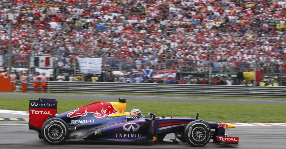 Red Bull Formula One driver Sebastian Vettel of Germany leads at the start of the Italian F1 Grand Prix at the Monza circuit September 8, 2013. REUTERS/Stefano Rellandini (ITALY - Tags: SPORT MOTORSPORT F1)