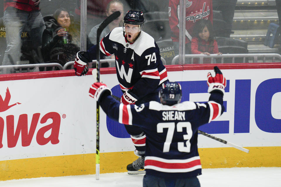 Washington Capitals defenseman John Carlson (74) celebrates his goal with left wing Conor Sheary (73) during the third period of an NHL hockey game against the Vancouver Canucks, Monday, Oct. 17, 2022, in Washington. (AP Photo/Jess Rapfogel)