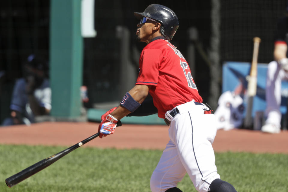 Cleveland Indians' Francisco Lindor watches his ball after hitting a two run home run in the first inning in the first baseball game of a doubleheader against the Chicago White Sox, Tuesday, July 28, 2020, in Cleveland. (AP Photo/Tony Dejak)