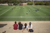 Spectators attend a training session ahead of a league match the next day in Rabat, Morocco, Tuesday, May 16, 2023. (AP Photo/Mosa'ab Elshamy)