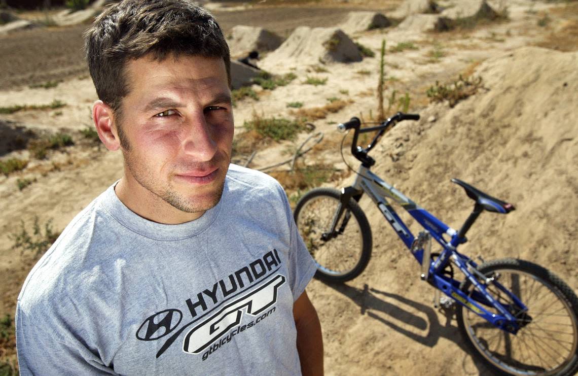 Randy Stumpfhauser, seen here at the height of his career in 2005, stands in the dirt bike track he built four and a half years ago at his Sanger home. Stumpfhauser is being inducted into the BMX Hall of Fame. Christian Parley/Fresno Bee Staff Photo