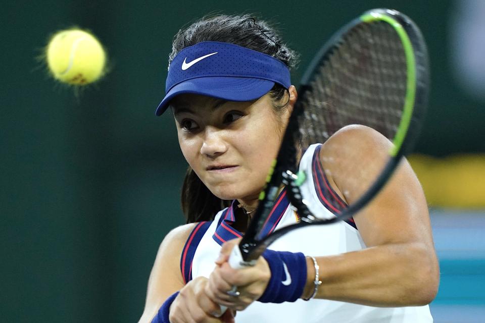 Emma Raducanu returns a shot to Alaksandra Sasnovich at the BNP Paribas Open tennis tournament Friday Oct. 8, 2021, in Indian Wells, Calif. (AP Photo/Mark J. Terrill)