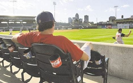 Iowa Cubs grounds crew member Cory Harther watches the game against the Nashville Sounds on June 14, 2008. "It's just weird not hearing the music when they walk up," said Harter.
