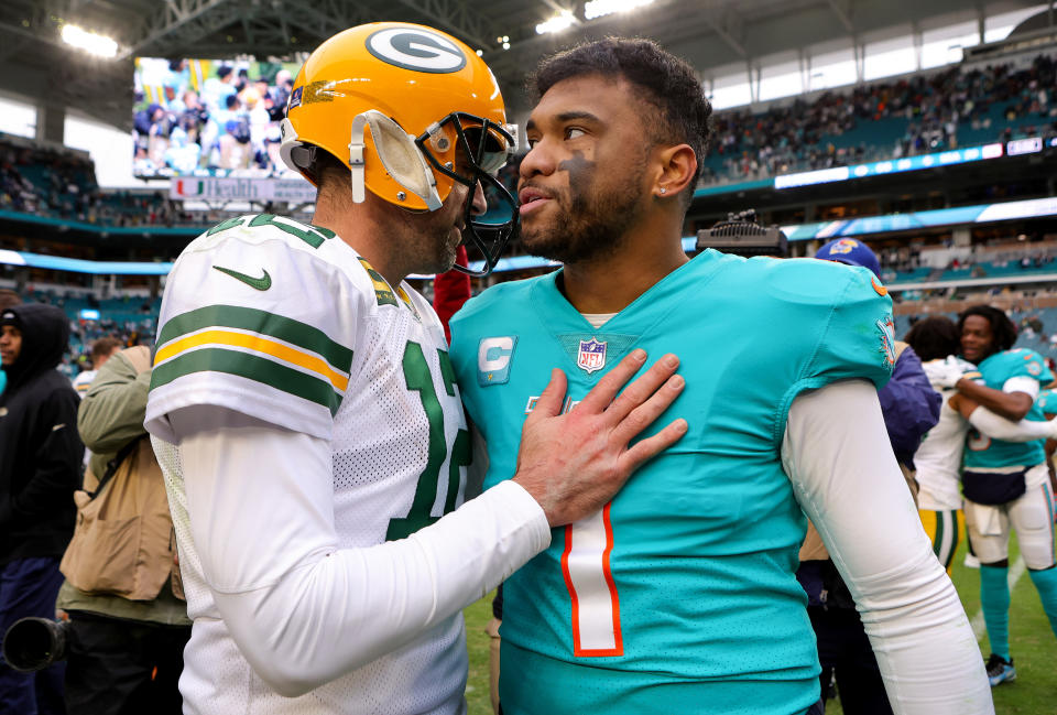 MIAMI GARDENS, FLORIDA - DECEMBER 25: NFL: Aaron Rodgers #12 of the Green Bay Packers hugs Tua Tagovailoa #1 of the Miami Dolphins on the field after the game at Hard Rock Stadium on December 25, 2022 in Miami Gardens, Florida. (Photo by Megan Briggs/Getty Images)