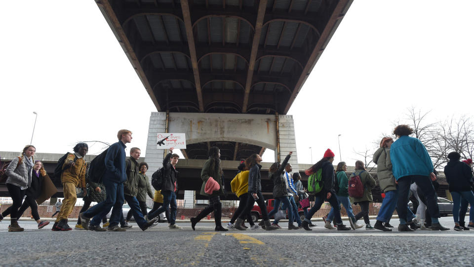 Students from Baltimore School for the Arts walk along Guilford Avenue on their way to City Hall on Tuesday. (Photo: Baltimore Sun via Getty Images)