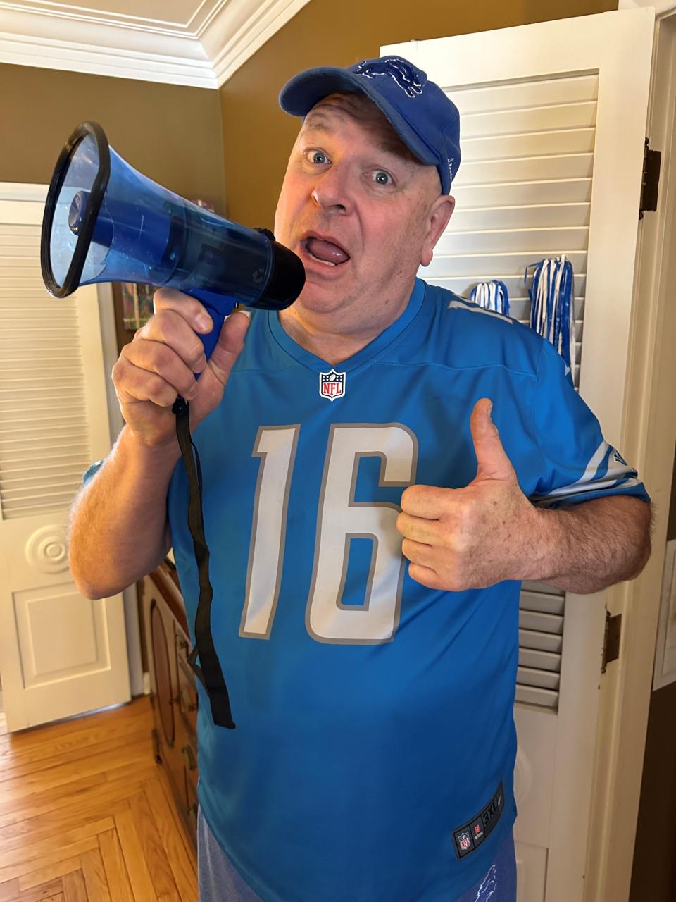 Scott Brown, of Royal Oak, brings his blue megaphone to tailgates at Detroit Lions home games and thanks guests for visiting. Brown has been a longtime fan and has run his own tailgates since the Lions played at the Silverdome.